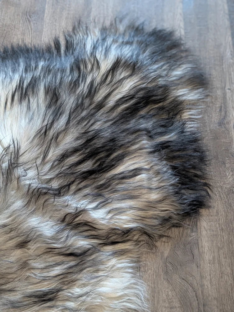 A plush fall#1 60 x 35 inch wool icelandic rug in natural grey with long wool icelandic tones of black gray and cream