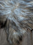 A plush natural grey icelandic sheepskin rug with long wool icelandic strands in silver gray and black tones