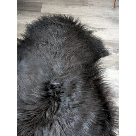 Plush black Icelandic sheepskin rug with long thick fur