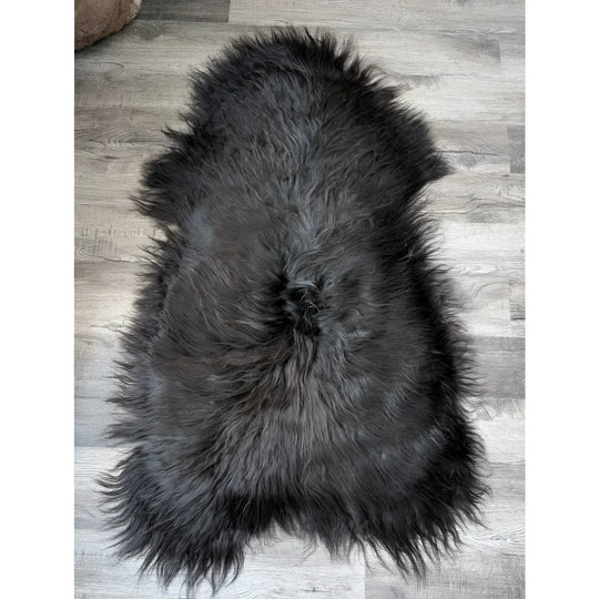 Massive 57x32 black Icelandic sheepskin rug with soft, dense fur