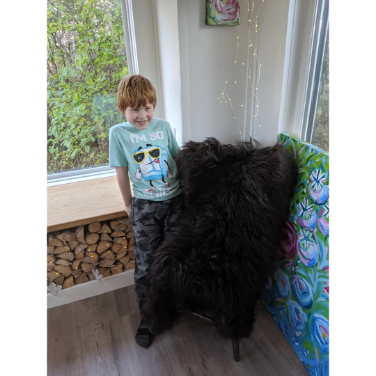 Black fluffy fur chair made with fantastic black icelandic sheepskin rug perfect for cozy home decor