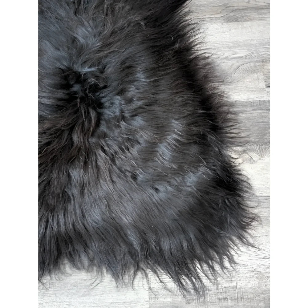 Massive 57x32 black Icelandic sheepskin rug with soft faux fur texture