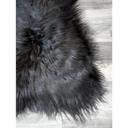 Massive 57x32 black Icelandic sheepskin rug with soft faux fur texture