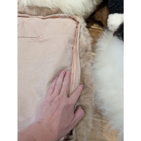 Cozy beige quilted highland sheepskin pet bed with pink lining