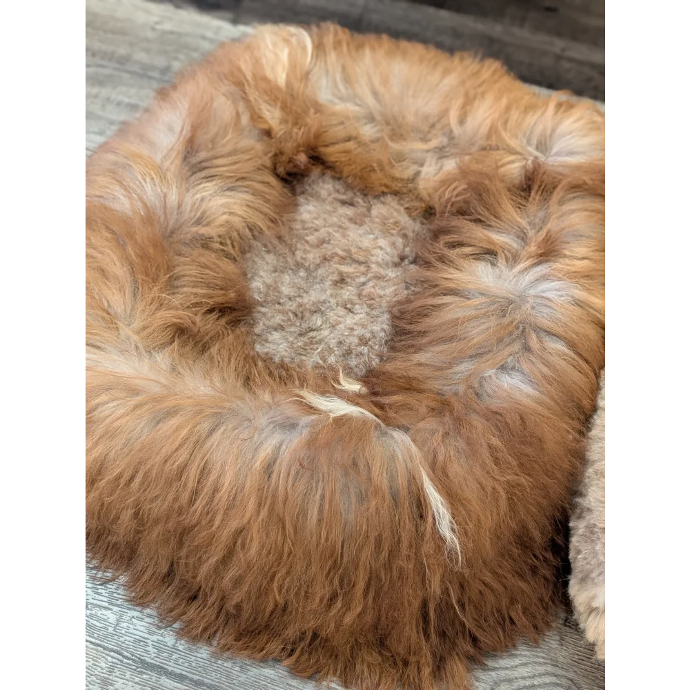 Cozy golden faux fur sheepskin pet bed with plush interior