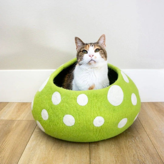 A lime green felt wool cat cave with white polka dots perfect as an eco kitty cave by friendsheep eco kitty