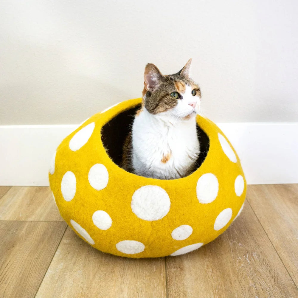 Yellow felt wool mushroom-shaped eco kitty cave with white polka dots perfect for friendsheep eco kitty lovers