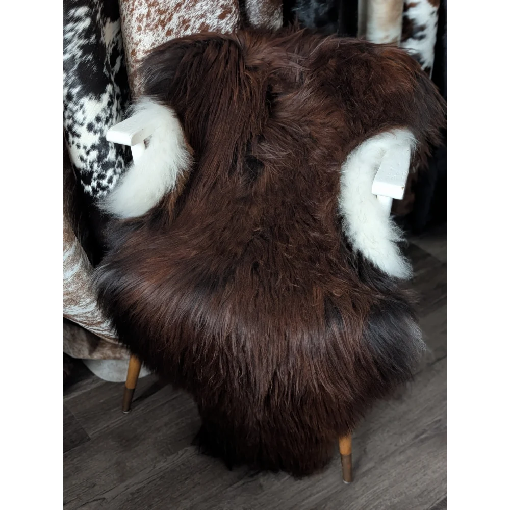 Gorgeous 56x33 Icelandic sheepskin rug by Angus Oliver, brown fur with white cuffs