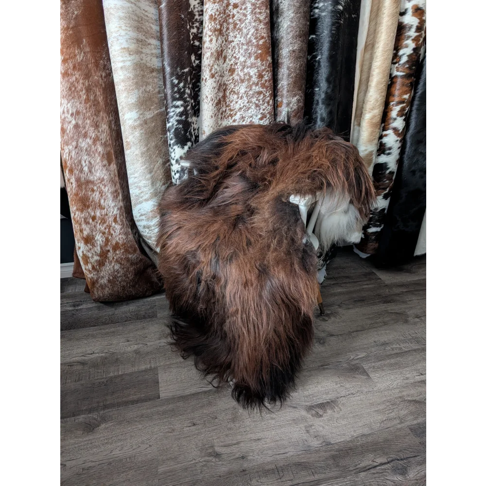 Gorgeous 66x36 Icelandic sheepskin rug by Angus Oliver, brown fur with white cowhide accents