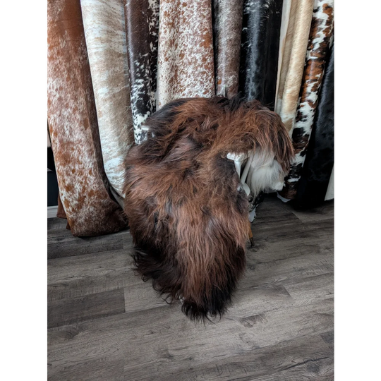 Gorgeous 66x36 Icelandic sheepskin rug by Angus Oliver, brown fur with white cowhide accents
