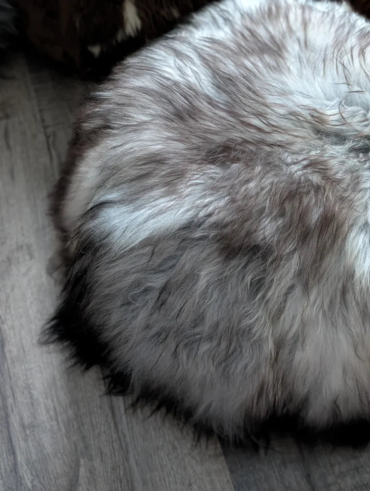 Cozy grey Icelandic sheepskin floor pouf pet bed