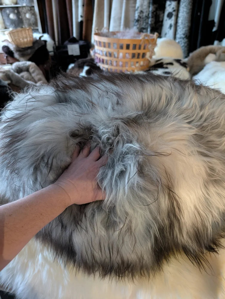 Fluffy grey Icelandic sheepskin floor pouf throw blanket