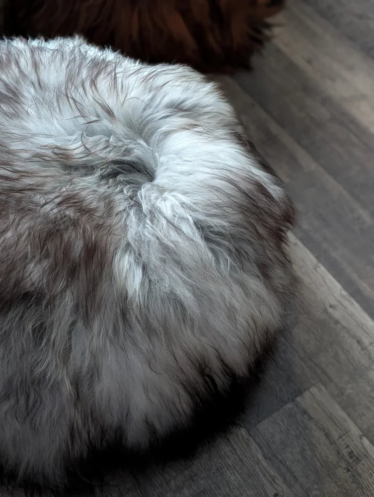Fluffy grey Icelandic sheepskin floor pouf, soft round pouf