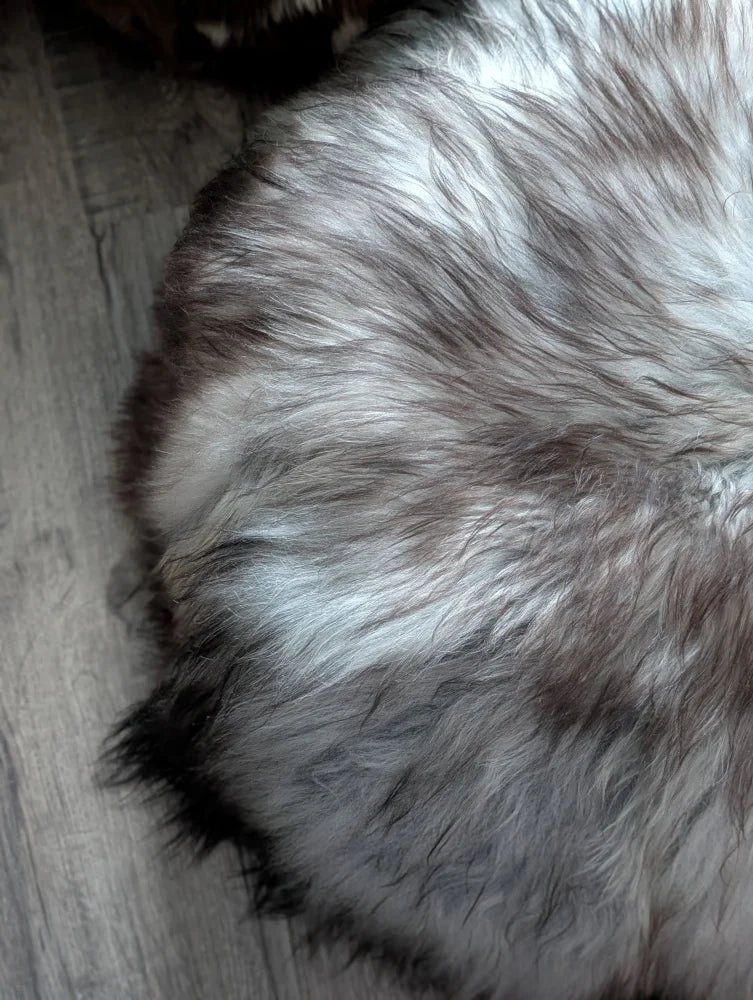 Fluffy gray white Icelandic sheepskin floor pouf rug