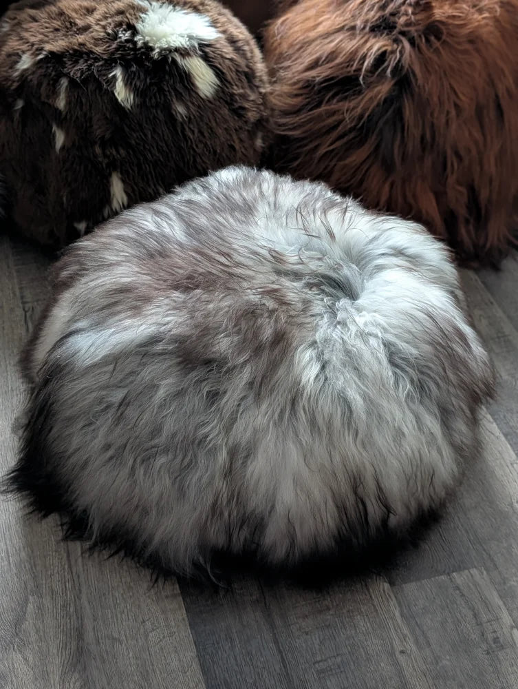 Grey Icelandic sheepskin floor pouf with soft fur texture