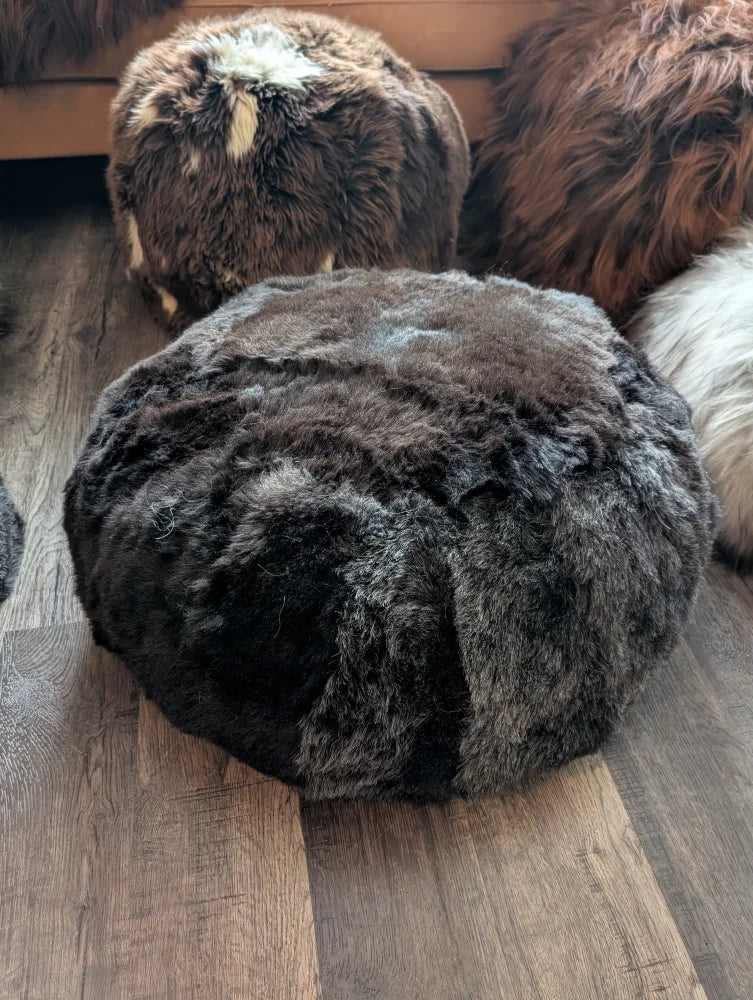 Shorn Icelandic sheepskin floor pouf in wolf faux fur