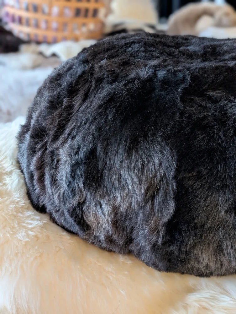 Plush Icelandic sheepskin floor pouf in wolf curly fur
