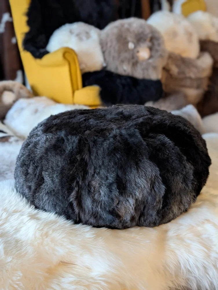 Plush dark gray Icelandic sheepskin floor pouf in wolf shorn style