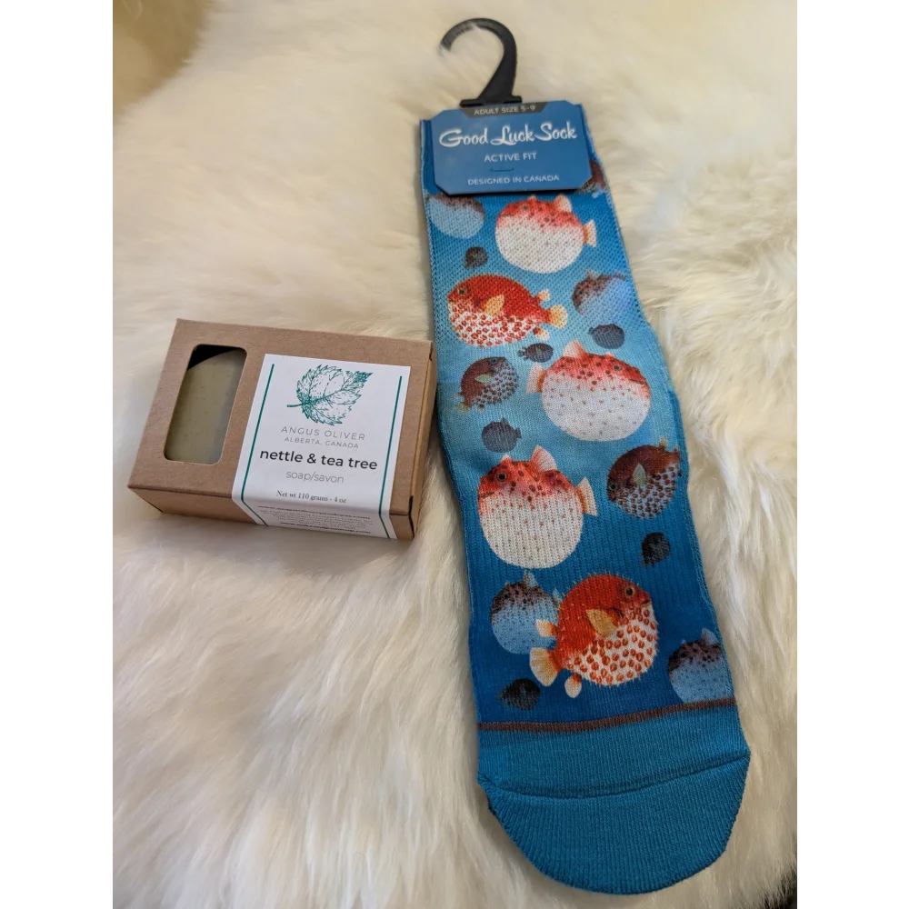 Blue sock with orange and white pufferfish pattern hanging on black hanger free with orders over 160 canada angus oliver
