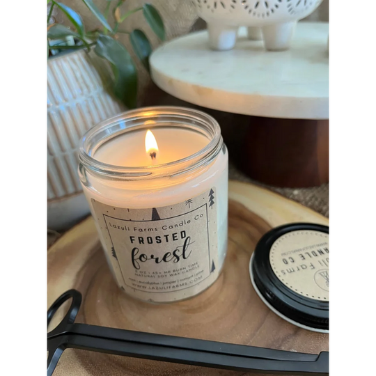Frosted forest candle in glass jar with white label, natural soy wax