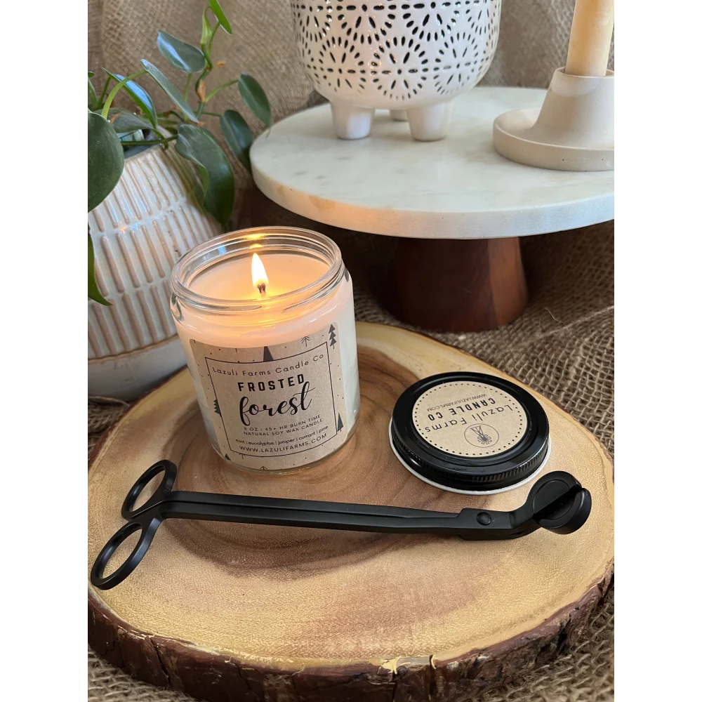 Frosted forest candle jar with black metal wick trimmer and lid