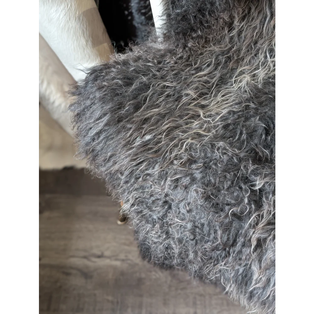 Cozy gray and white curly Gotland sheepskin throw by Oliver Luxury Sheepskins