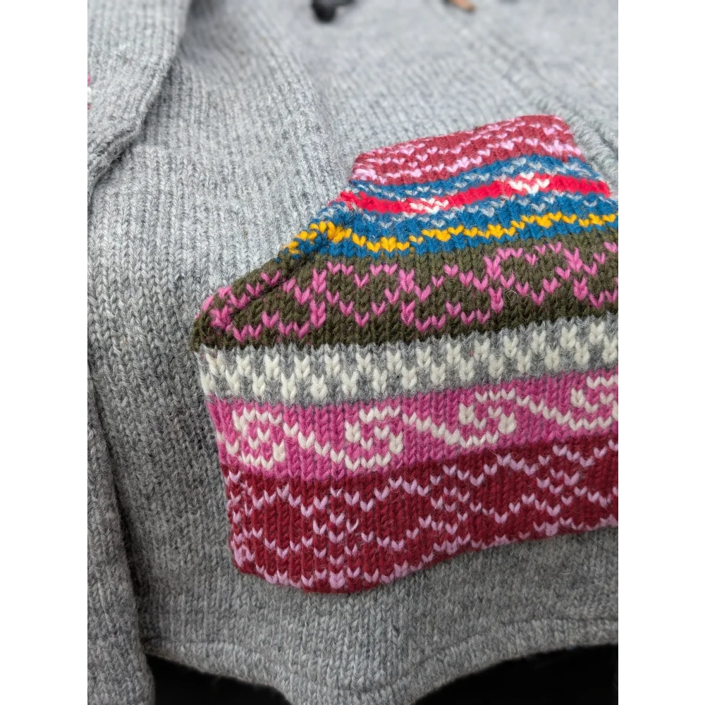 Grey fair trade wave cardigan with colorful fair isle sleeves