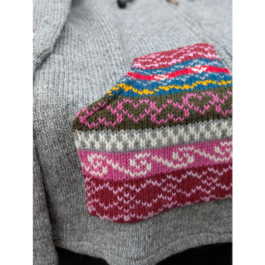 Grey fair trade wave cardigan with colorful fair isle sleeves