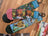 A pair of colorful good luck socks with forest and bee design on one and ice cream cone on the other