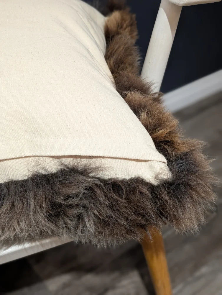 Gorgeous british sheepskin cushion with cream-colored unbleached cotton canvas and plush brown faux fur trim