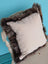 Beige british sheepskin cushion with plush dark brown faux fur trim made from unbleached cotton canvas by angus oliver