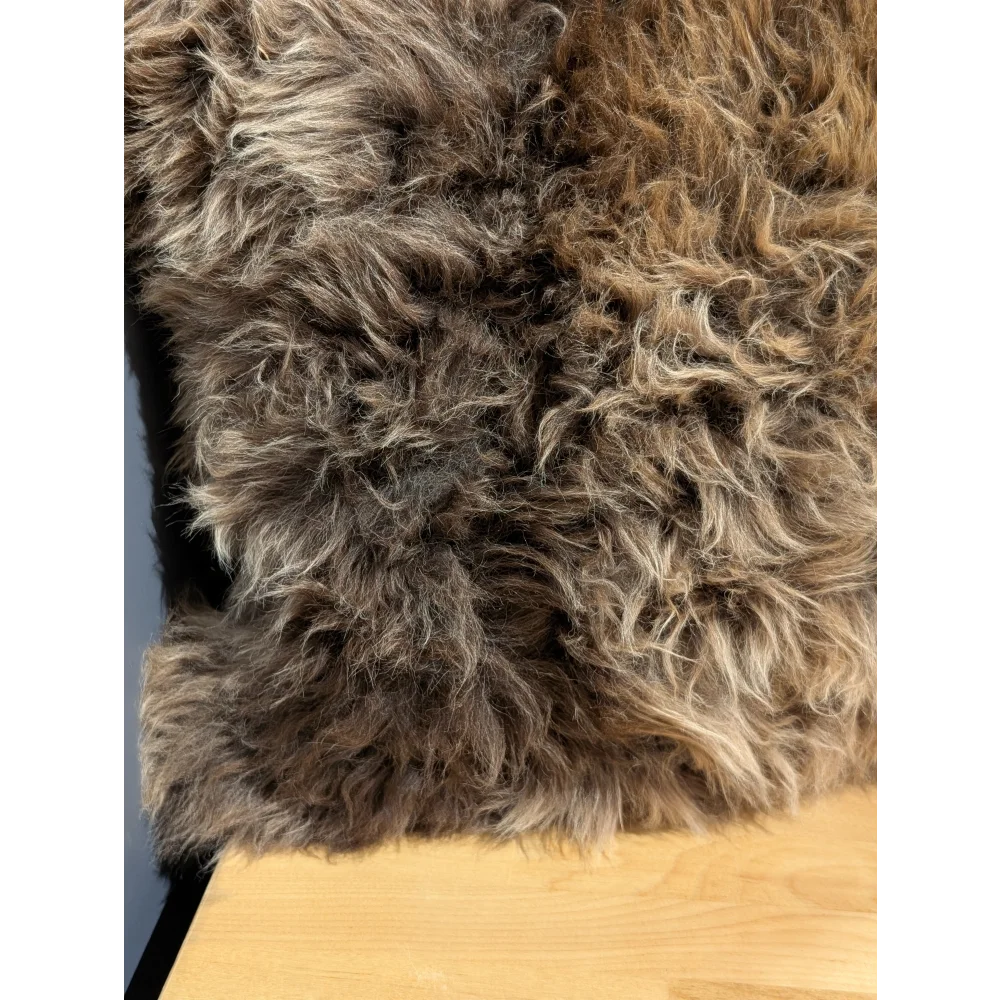 Gorgeous british sheepskin cushion with a plush curly brown rug front and unbleached cotton canvas backing