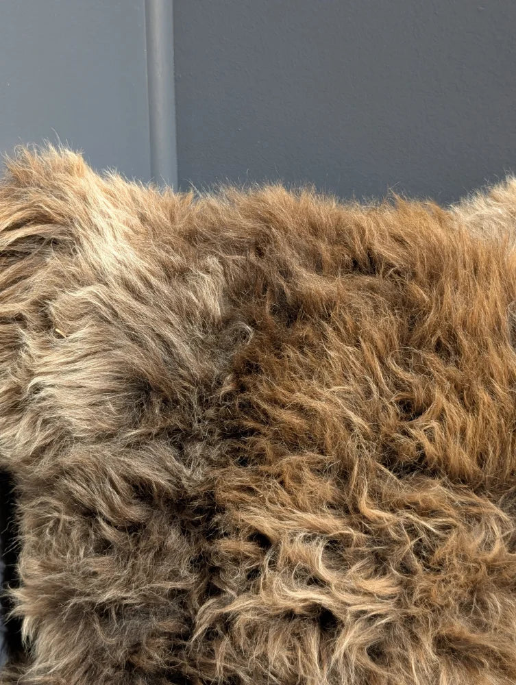 Gorgeous british sheepskin cushion with a plush brown sheepskin throw on unbleached cotton canvas backing