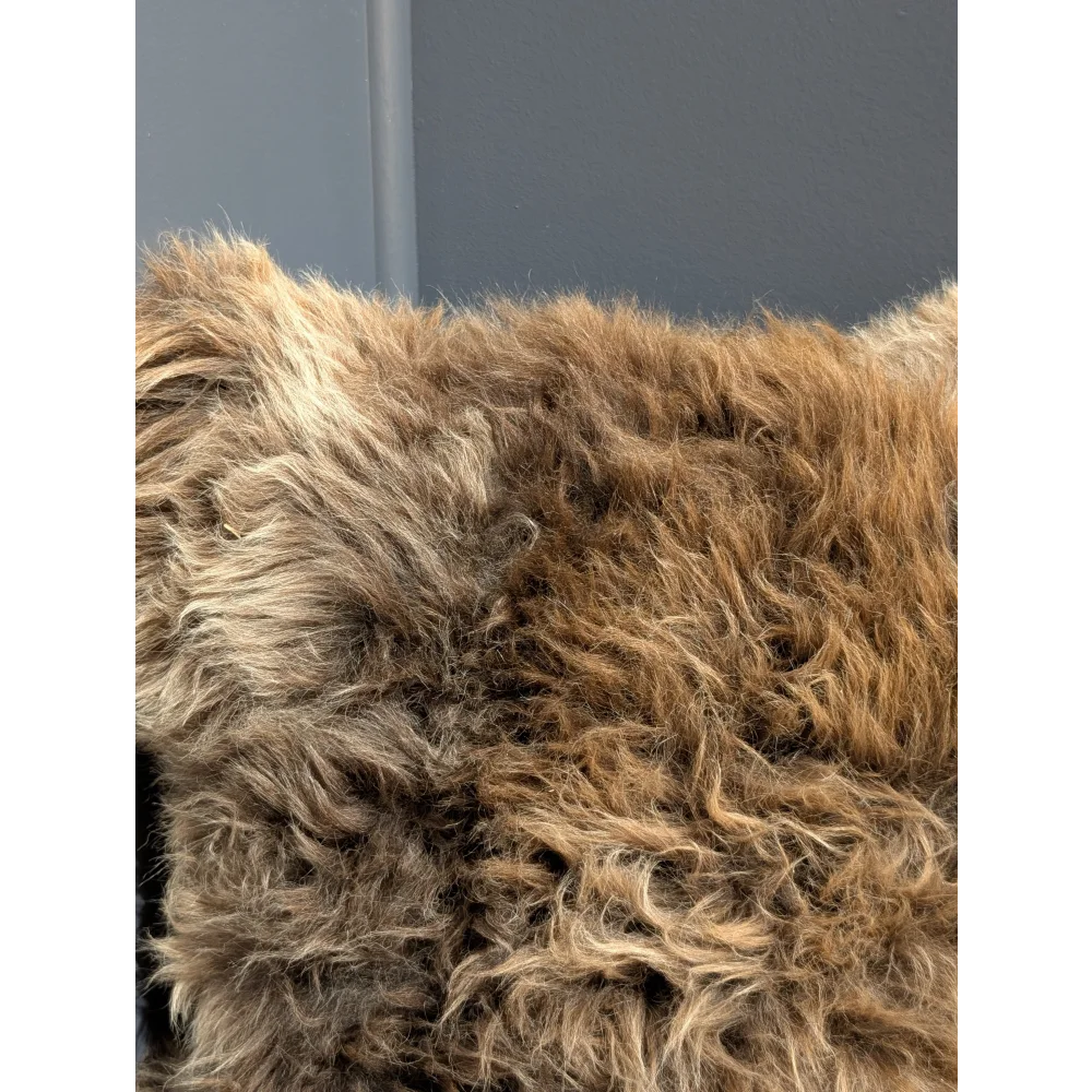 Gorgeous british sheepskin cushion with a plush brown sheepskin throw on unbleached cotton canvas backing