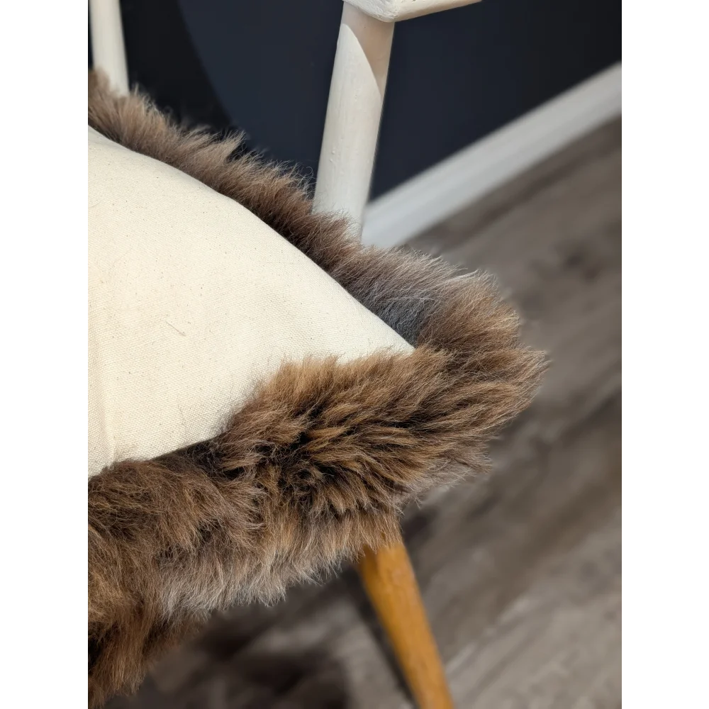 Gorgeous british sheepskin cushion with cozy brown faux fur trim on cream unbleached cotton canvas seat