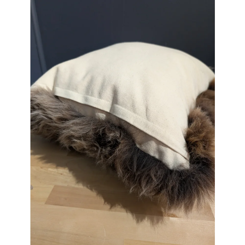 Gorgeous british sheepskin cushion with cream-colored unbleached cotton canvas and plush brown faux fur trim