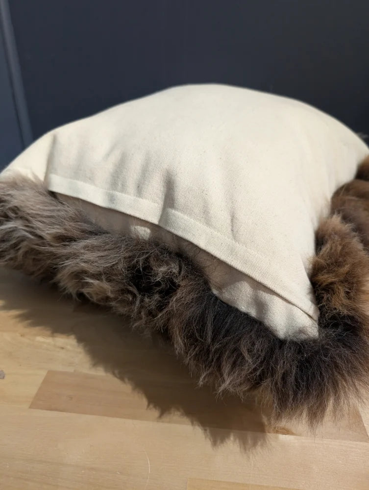 Gorgeous british sheepskin cushion with cream-colored unbleached cotton canvas and plush brown faux fur trim