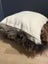 Gorgeous british sheepskin cushion with cream-colored unbleached cotton canvas and plush brown faux fur trim