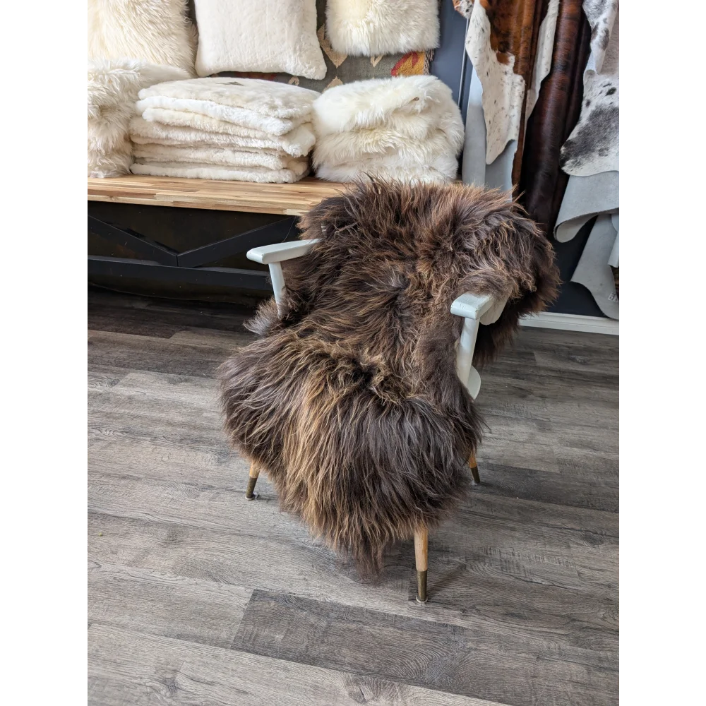 Gorgeous bronze Icelandic sheepskin chair cover with natural fur and wooden legs