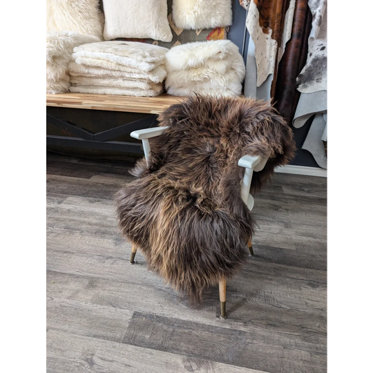 Gorgeous bronze Icelandic sheepskin chair cover with natural fur and wooden legs