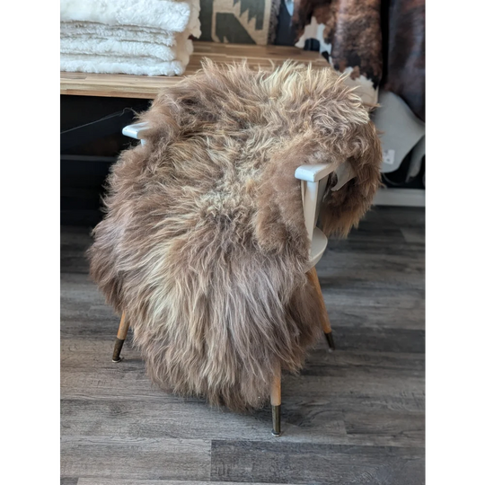 Gorgeous bronze Icelandic sheepskin chair cover in natural tones