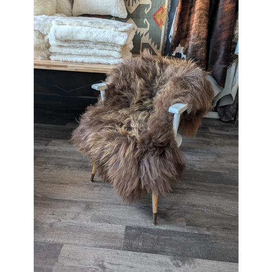 Gorgeous bronze Icelandic sheepskin chair with light brown fur and wooden legs