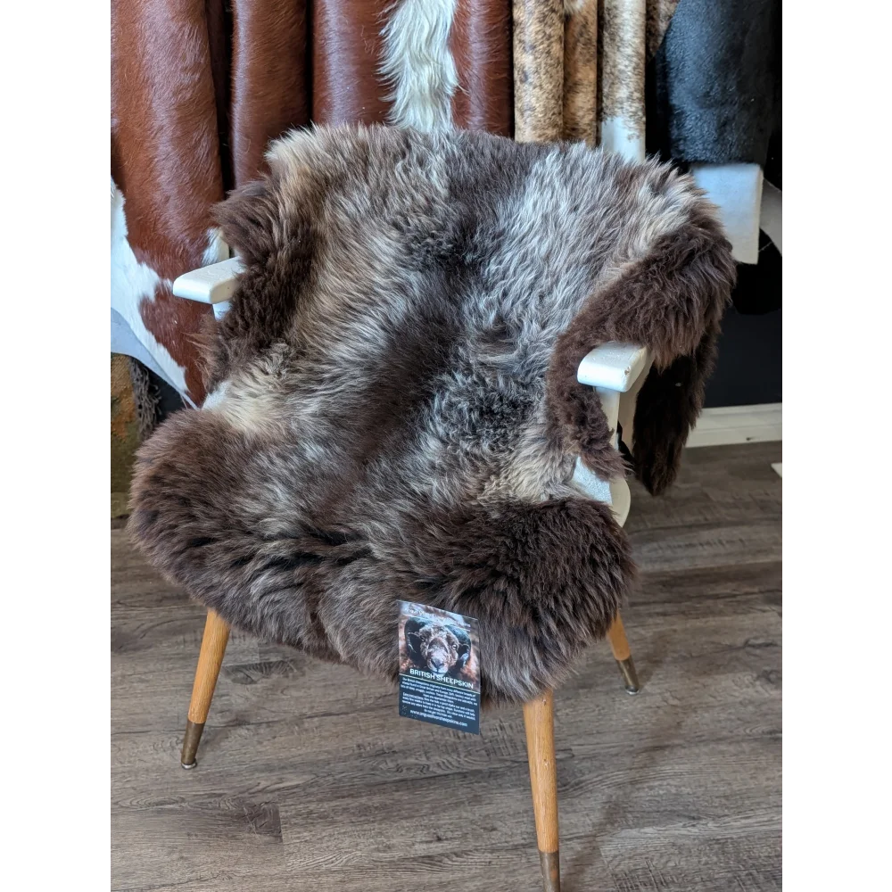 Rare British sheepskin chair with brown faux fur, wooden legs, white horns