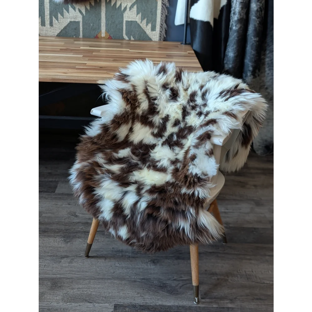Gorgeous fluffy British sheepskin cowhide chair cover with brown white spots