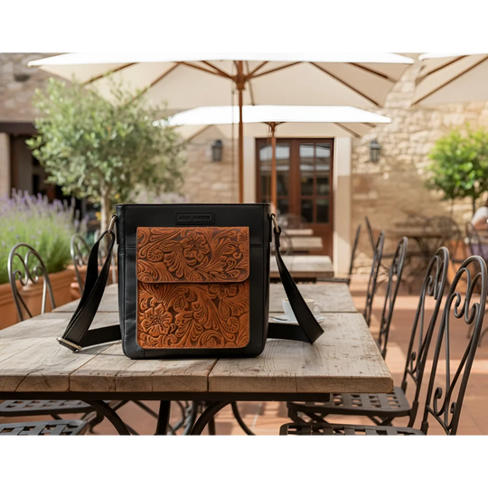 Black embossed genuine leather crossbody bag with tan floral flap