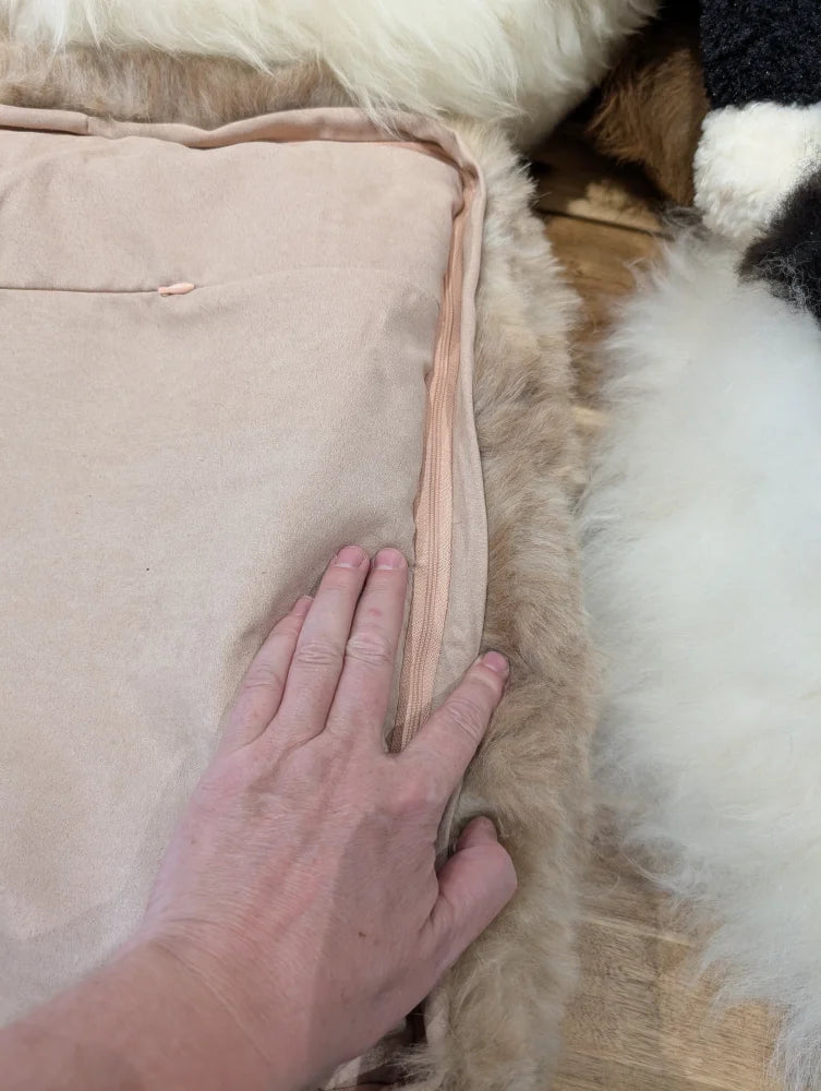 Cozy beige quilted highland sheepskin pet bed with pink lining
