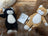 Cozy black and white cat plush on sheepskin pet bed