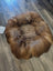 Cozy brown faux fur sheepskin pet bed with soft circular design
