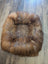 Cozy faux fur sheepskin pet bed in warm brown tan tones