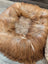 Cozy golden faux fur sheepskin pet bed with plush interior